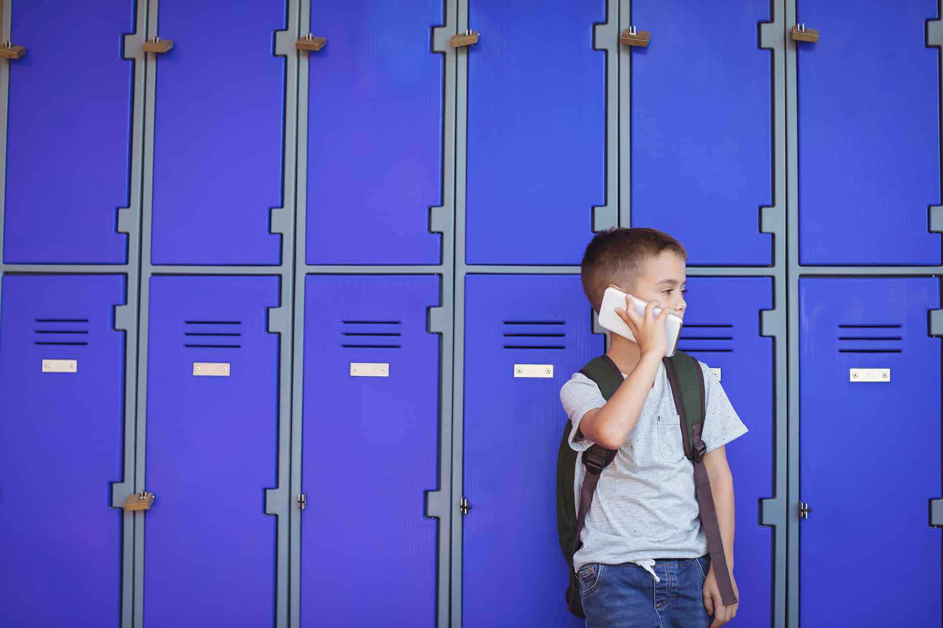 kid leaning on blue lockers-Premier Lockers